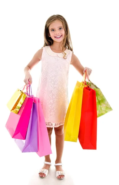 Adorable niña pequeña sosteniendo compras coloridas bolsas de papel — Foto de Stock