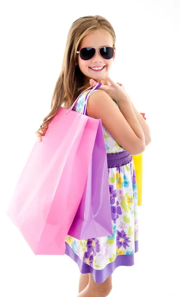Bedårande liten flicka barn solglasögon håller shopping färgglada — Stockfoto