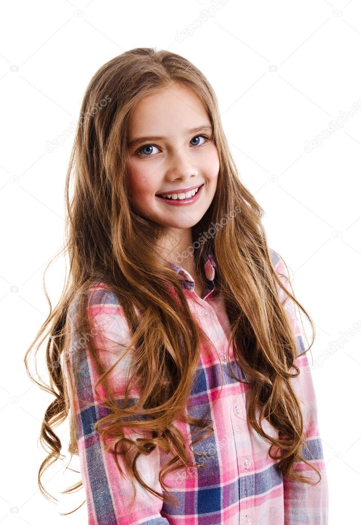 Portrait of adorable smiling little girl child preteen isolated on a white background. Dental concept