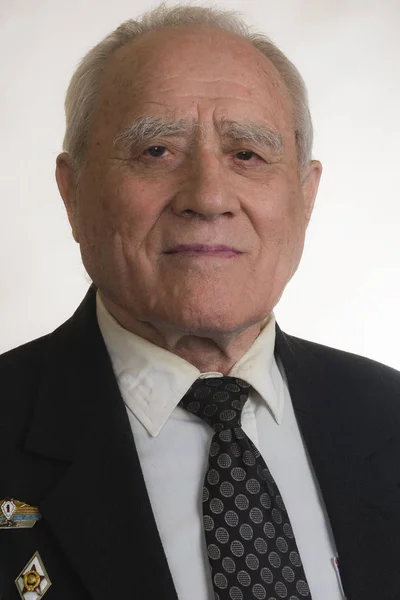 Portrait of elderly man in black jacket — Stock Photo, Image