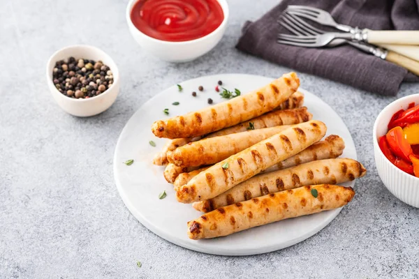 Grilled sausages on light background. Copy space. — Stock Photo, Image