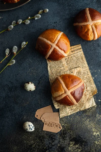 Traditional Easter cross buns on easter background.