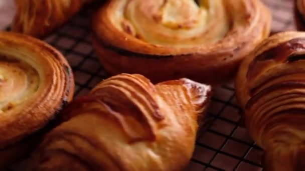 Morning breakfast with delicious French croissants. Croissants and escargots. Confectionery. Fresh bakery. Slow motion food. — Stock Video