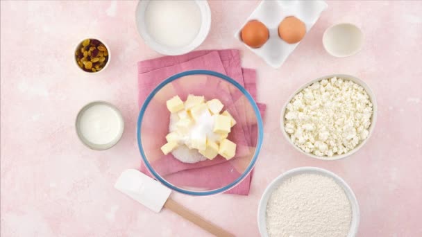 Homemade cookies and cottage cheese. Stop motion food. Sochniki. Cooking Cookies on a delicate pink background. Shortcrust pastry. — Stock Video