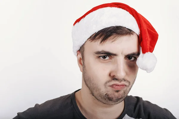 Envious Young Man Santa Hat Looking Camera — Stock Photo, Image