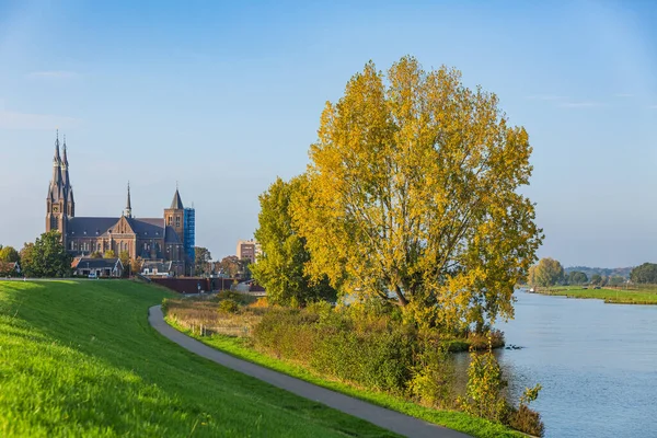 Land van Cuijk, agricultural landscape at the small village Cuijk and the Meuse river, the Netherlands under a blue sky. Popular touristic landmark for travel