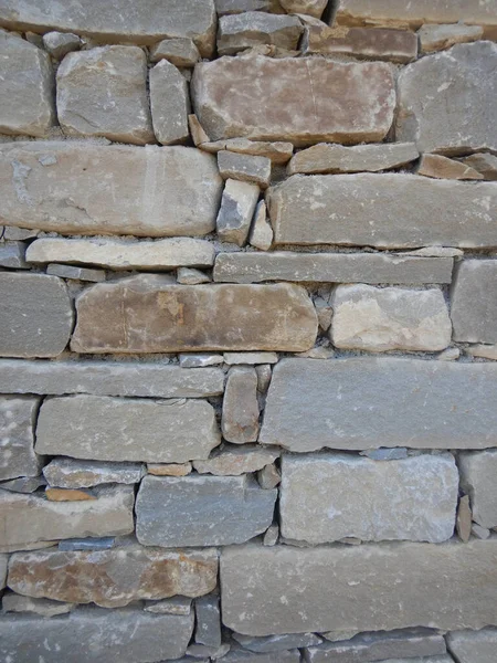 A wall of a country house in the Langhe built with stone blocks, Piedmont - Italy