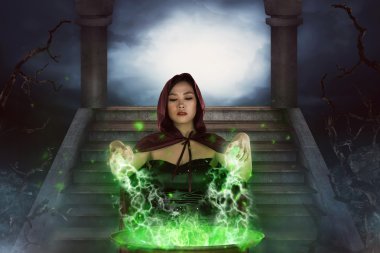 Asyalı kadın cadı kazanı ile