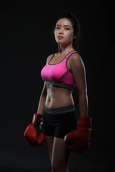 Beautiful asian woman with the red boxing gloves — Stock Photo, Image