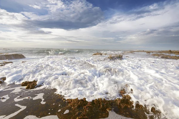 Sawarna stenig strand — Stockfoto