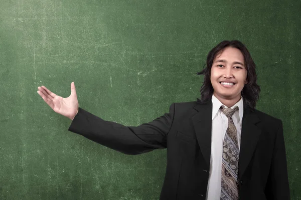 Asian businessman showing something — Stock Photo, Image