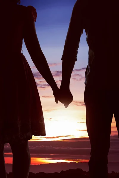 Young asian couple at sunset — Stock Photo, Image