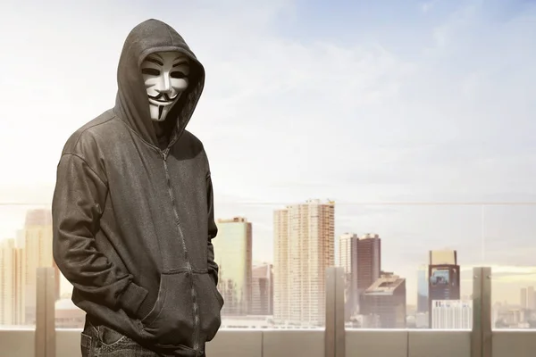 Hacker in mask and gloves — Stock Photo, Image
