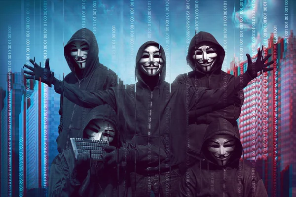Hackers in masks with keyboard — Stock Photo, Image
