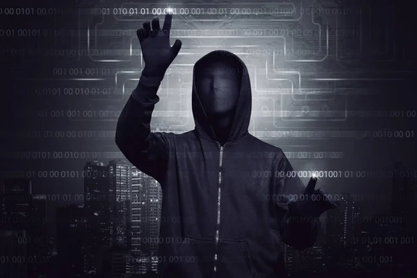 Hacker in mask and gloves — Stock Photo, Image