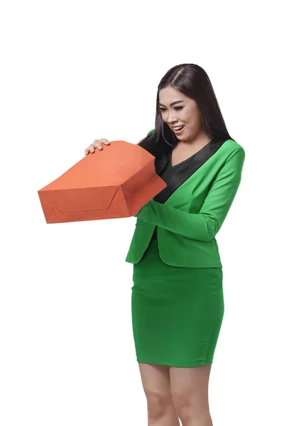 Businesswoman opening shopping bag — Stock Photo, Image