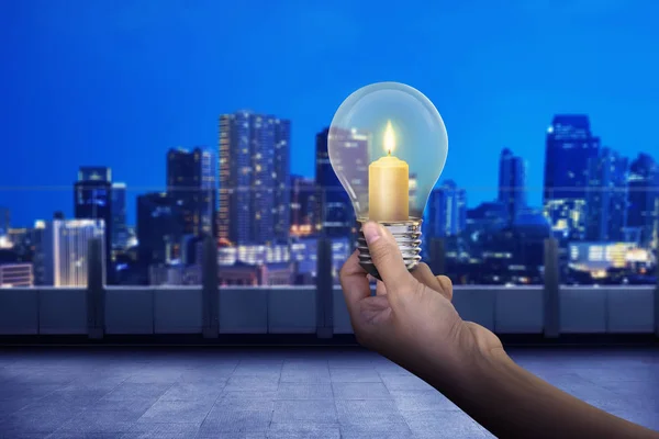 Hand holding light bulb — Stock Photo, Image