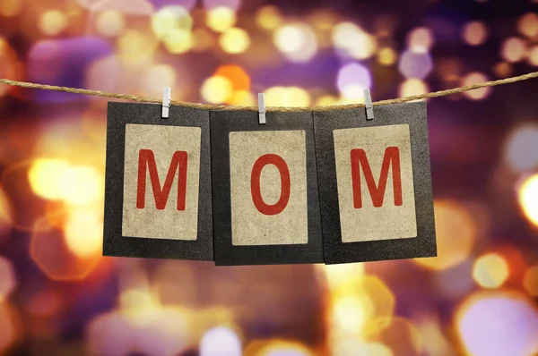 Mom word shape hanging with clothespin — Stock Photo, Image