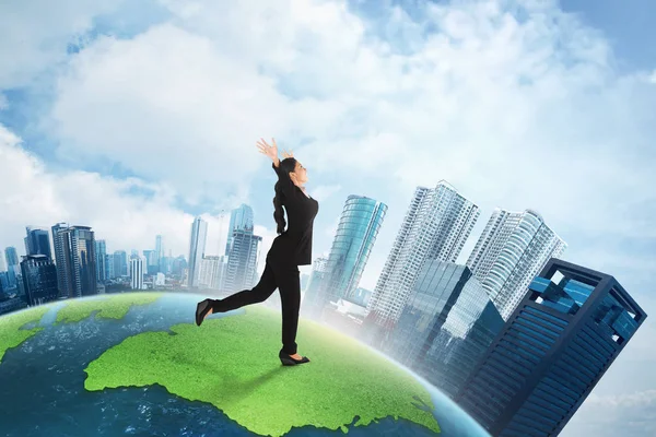 Asian business woman running on earth — Stock Photo, Image