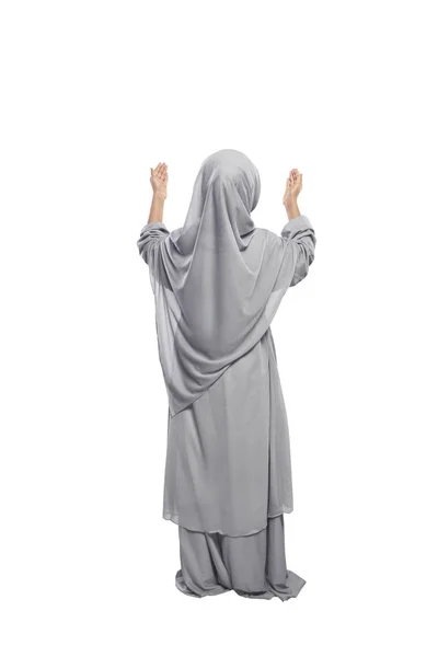 Muslim girl raising hands and praying — Stock Photo, Image