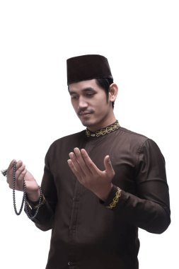 Cap dua ile Asya Müslüman dindar 