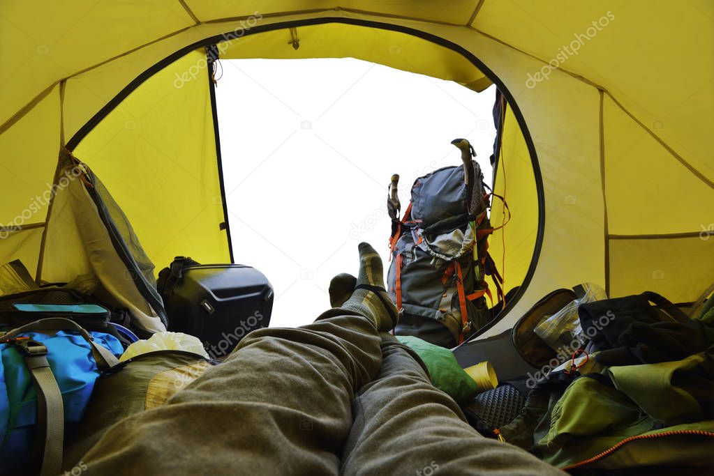 Traveler lying down in the tent