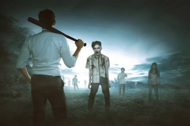 Asyalı adamın beyzbol sopası zombi karşı tutan arkadan görünüm 