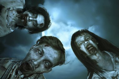 Yaralı yüzü ile Asya kanlı zombi dikey grup