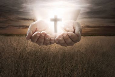 Human hand hold christian cross clipart
