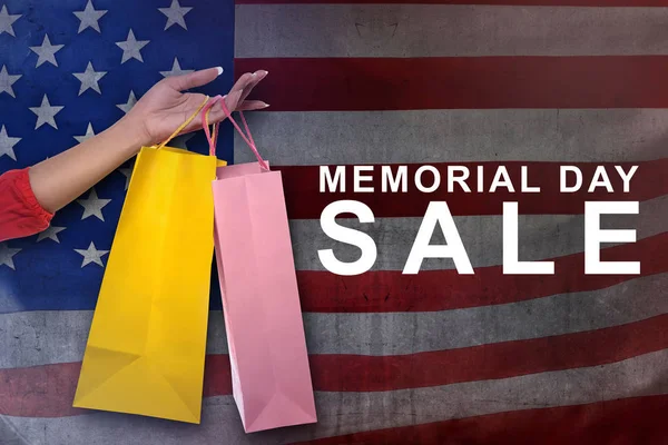 Female Hand Shopping Bags Memorial Day Sale American Flag Background — Stock Photo, Image