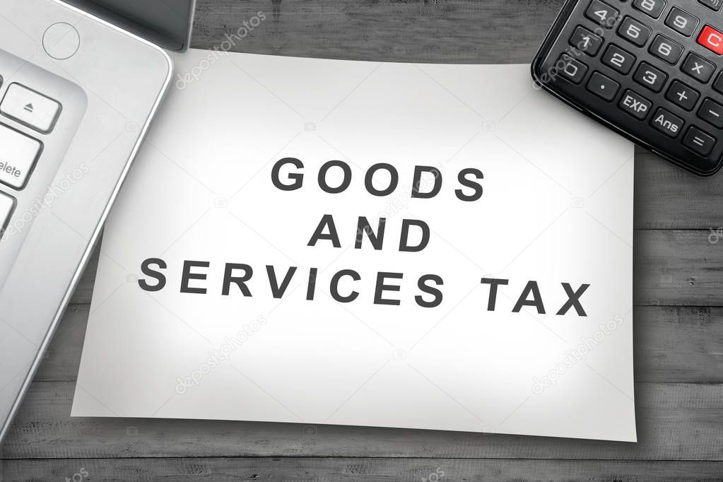 Goods and Service Tax sign on the paper. Goods and services tax concept