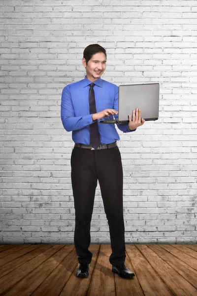 Young Asian Businessman Standing While Typing Laptop White Wall Background — Stock Photo, Image