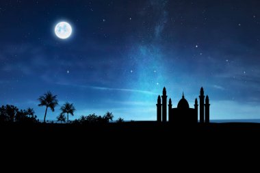 Silhouette of mosque with high minaret on the night