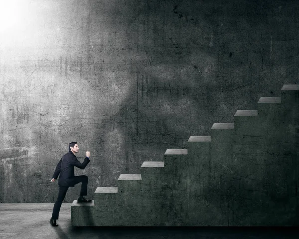 Attractive Asian Businessman Stepping Staircase Grunge Wall Background — Stock Photo, Image