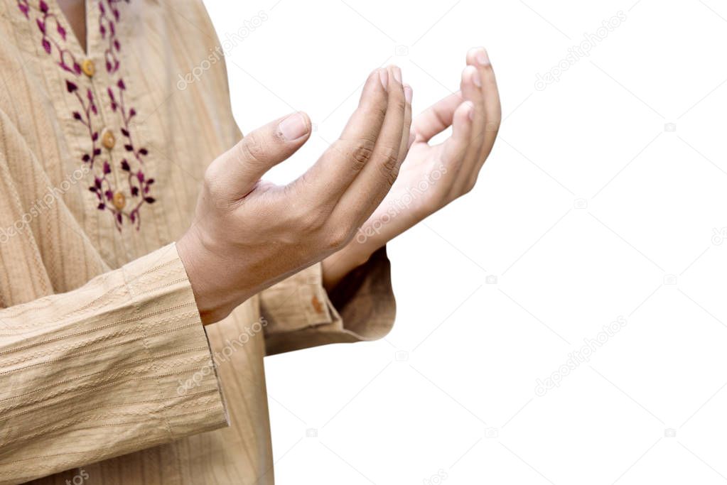 Muslim man raising hand and praying isolated over white background