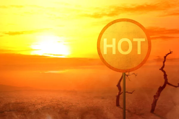 Circle signpost with hot text on the desert with dead trees and — Stock Photo, Image