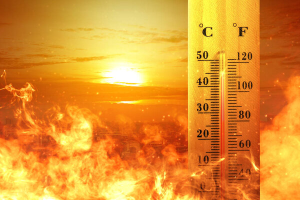 Thermometer with high temperature on the city with glowing sun b
