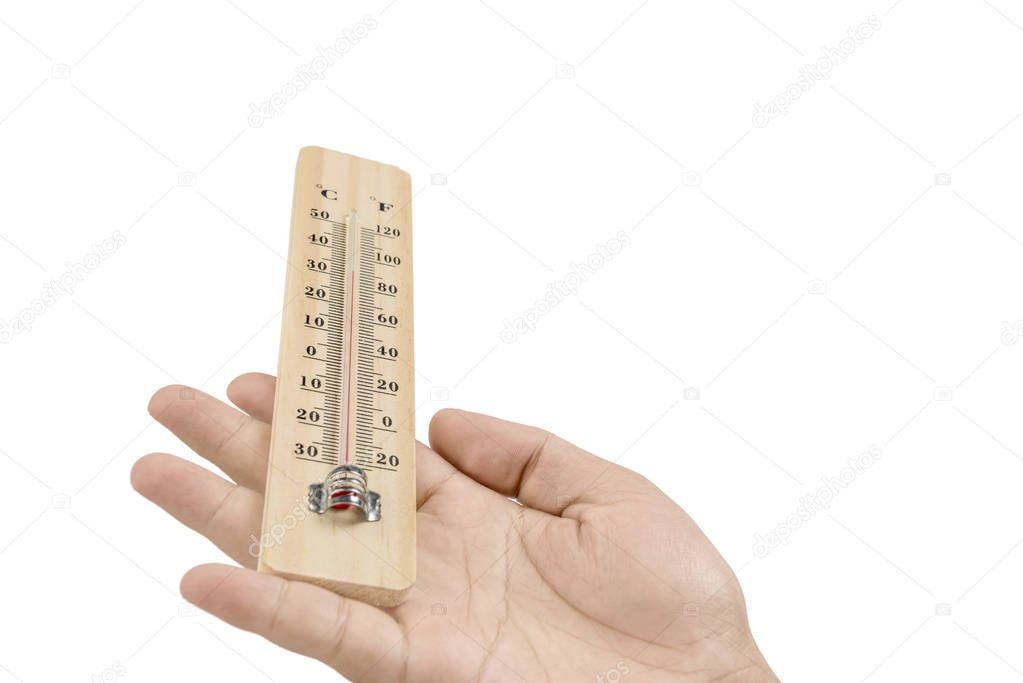 Hand holding wooden thermometer