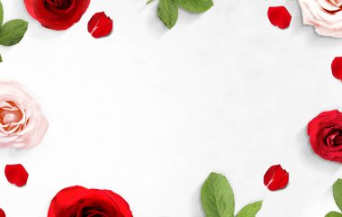 The frame of red and pink roses and rose petals on the floor 