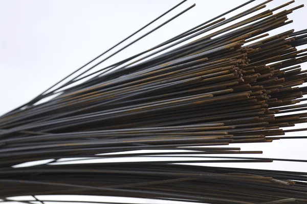 Reinforcing bars with a periodic profile in the packs are stored in the metal products warehouse — Stock Photo, Image