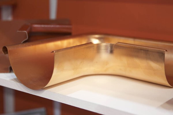 Bent copper profile for drainage system