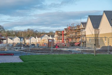 Perceton, Irvine, Scotland, UK - March 29, 2020: Dawn Homes Building site on lockdown due to Covid-19 corona virus. Houses at various stages of completion until lock down lifted. clipart