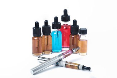 Two electronic cigarettes with glass e-liquid bottles on white blackground clipart