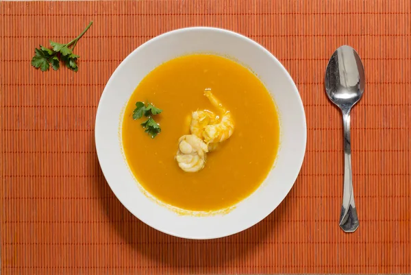 Beautiful presentation of the fish soup in a white plate on a or — Stock Photo, Image