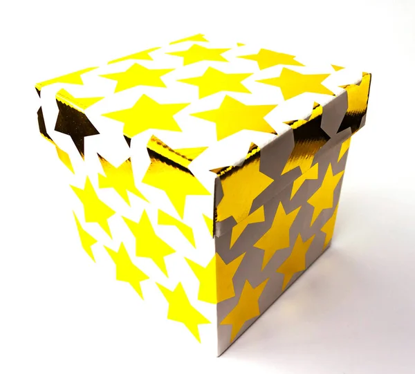Single white starred gift paper box on white background. Holyday present concept