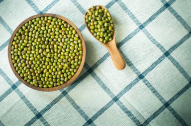  mung bean green in spoon on the tablecloth in bowl clipart