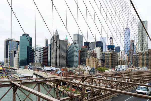 NEW YORK - APRIL 29, 2016: View on downtown manhattan from the famous Brooklyn bridge