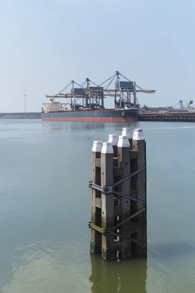 Waterway poles in harbor — Stock Photo, Image