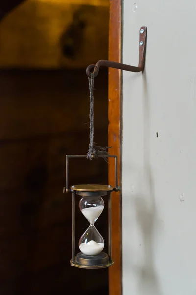 Hourglass in a ship — Stock Photo, Image