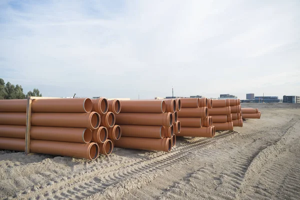 Piled up pvc pipes — Stock Photo, Image